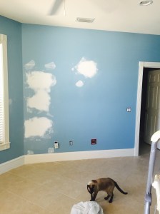 blue bedroom wall before painting